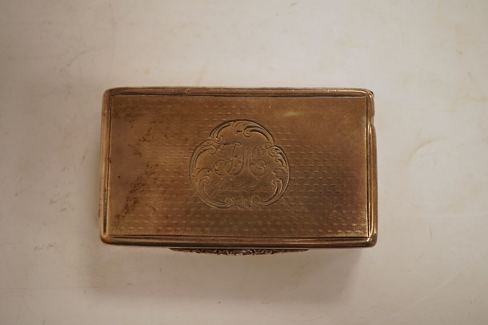 A Victorian engraved silver snuff box, Yapp & Woodward, Birmingham, 1899, 68mm, a small silver scent bottle and two silver-mounted glass scent bottles.